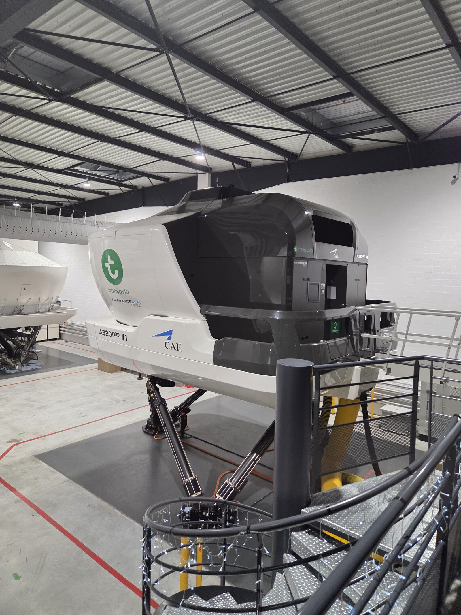 CAE A320neo full-flight simulator on its motion platform in the training bay
